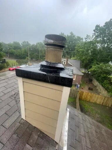 Freshly sealed chimney chase cover and cap installed by Chimney Works in Olive Branch, MS